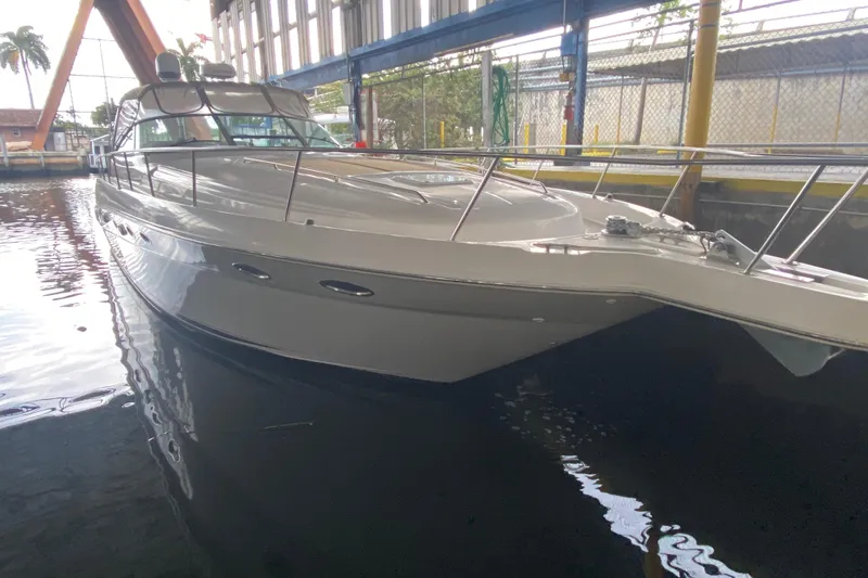 Slide: The Image of 2000 Sea Ray 460 Express Cruiser docked in a marina, side view. - 3
