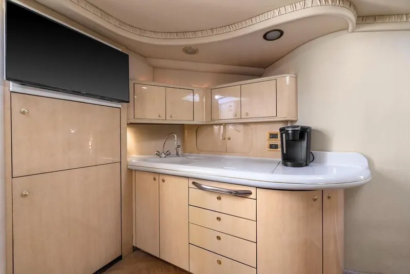 Slide: The Image of Luxurious kitchen area in a 2000 Sea Ray 460 Express Cruiser yacht. - 36