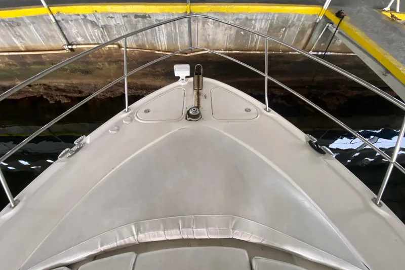 Slide: The Image of Bow view of 2005 Sea Ray 500 Sundancer yacht in a dock. - 11