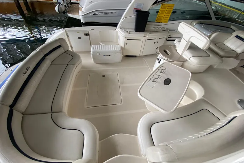 Slide: The Image of Luxurious 2005 Sea Ray 500 Sundancer yacht interior with white seating and table. - 17