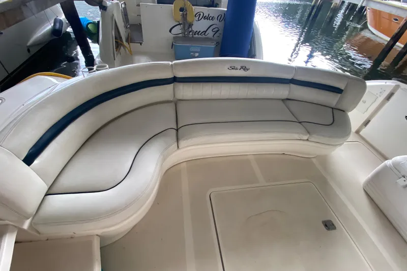 Slide: The Image of Luxurious seating on a 2005 Sea Ray 500 Sundancer yacht, docked in a marina. - 18