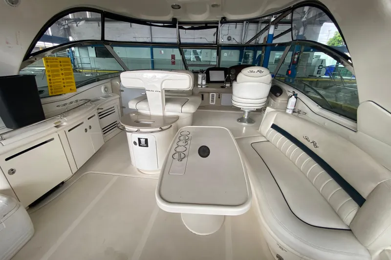 Slide: The Image of Luxurious interior of a 2005 Sea Ray 500 Sundancer yacht with elegant seating and helm. - 19
