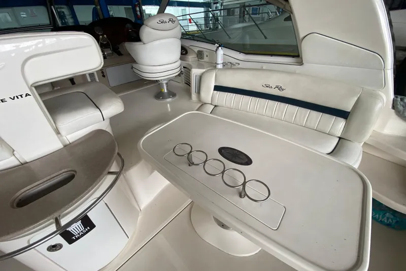 Slide: The Image of Interior of a 2005 Sea Ray 500 Sundancer yacht with seating and table. - 20