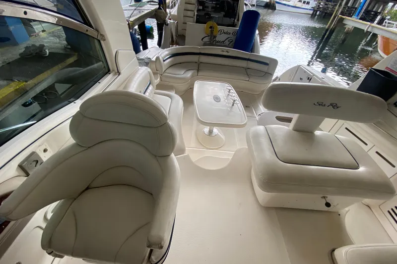 Slide: The Image of Luxurious interior of a 2005 Sea Ray 500 Sundancer yacht with plush seating and table. - 24