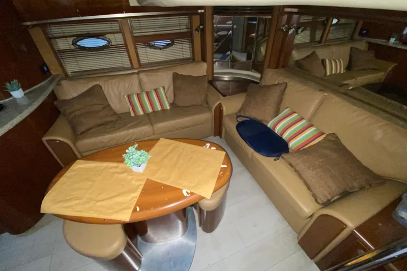 Slide: The Image of Luxurious interior of a 2005 Sea Ray 500 Sundancer yacht with cozy seating and elegant decor. - 27