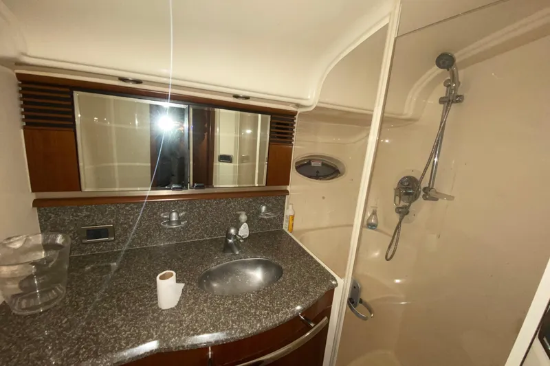 Slide: The Image of Luxurious bathroom in 2005 Sea Ray 500 Sundancer yacht with granite countertop and shower. - 37