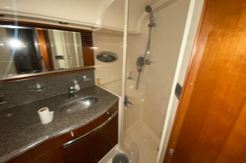 Slide: The Image of Luxurious bathroom in 2005 Sea Ray 500 Sundancer yacht with granite countertop and shower. - 38