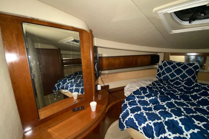 Slide: The Image of Luxurious cabin interior of 2005 Sea Ray 500 Sundancer yacht with elegant wood finishes. - 40