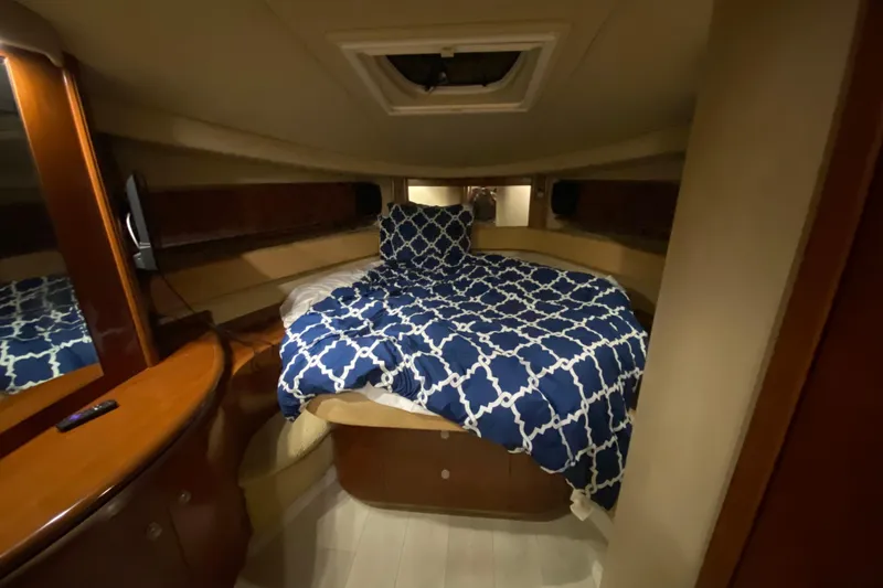 Slide: The Image of Luxurious cabin interior of 2005 Sea Ray 500 Sundancer yacht with patterned bedding. - 43
