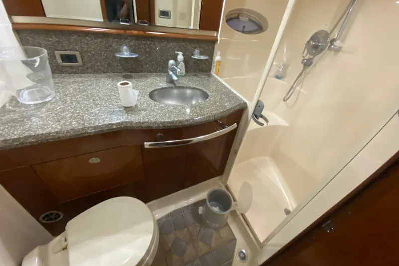Slide: The Image of Luxurious bathroom in 2005 Sea Ray 500 Sundancer yacht with granite countertop and shower. - 44