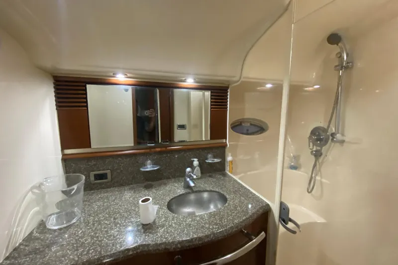 Slide: The Image of Luxurious bathroom in a 2005 Sea Ray 500 Sundancer yacht with granite countertop and shower. - 45