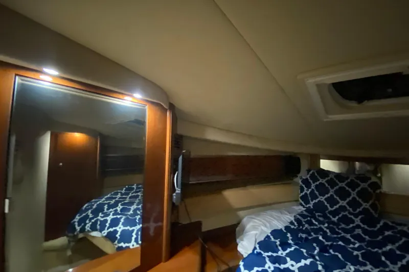 Slide: The Image of Luxurious cabin interior of 2005 Sea Ray 500 Sundancer yacht with cozy bedding. - 46