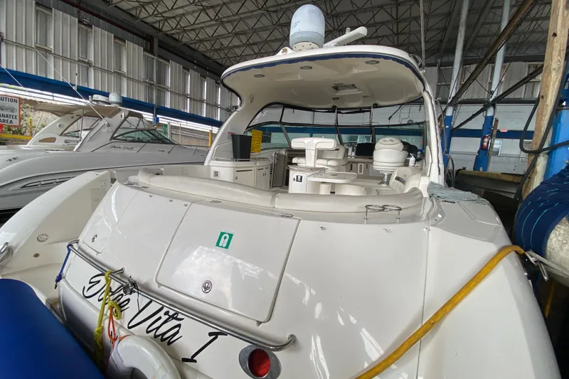 Slide: The Image of 2005 Sea Ray 500 Sundancer yacht docked in a marina, rear view. - 57