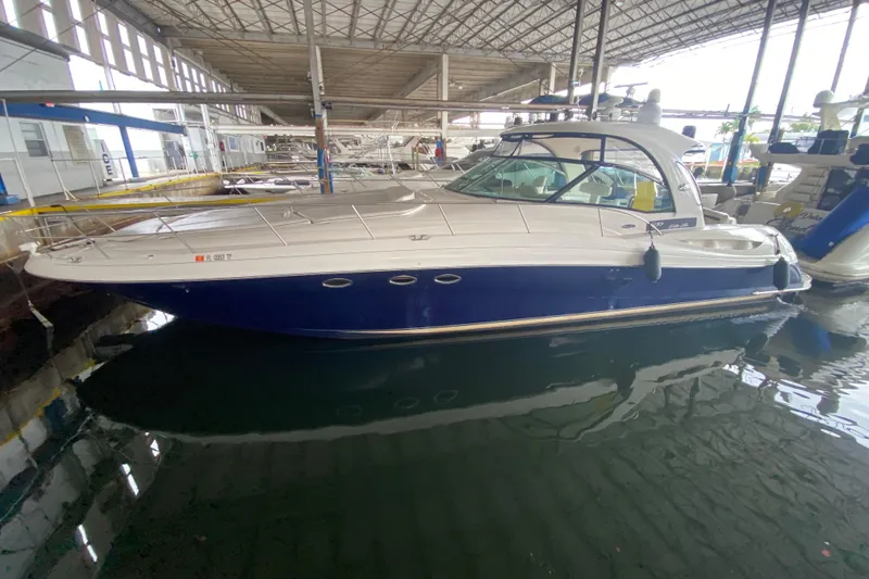 Slide: The Image of 2005 Sea Ray 500 Sundancer yacht docked in a covered marina. - 6