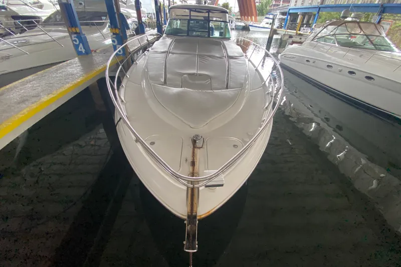 Slide: The Image of 2005 Sea Ray 500 Sundancer yacht docked in a marina, front view. - 7