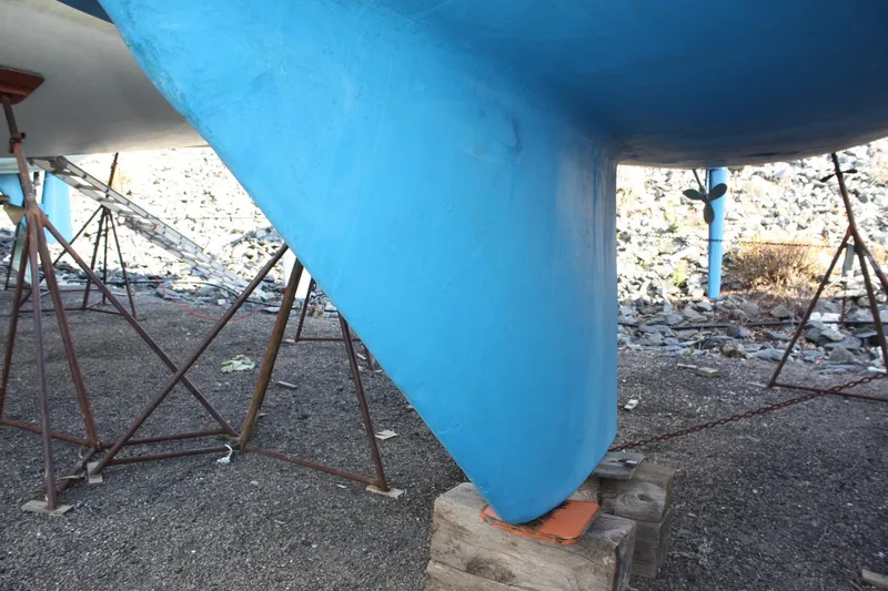 Slide: The Image of Blue keel of a 1986 Catalina 36 sailboat on stands. - 11
