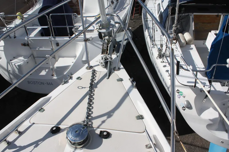 Slide: The Image of Bow of 1986 Catalina 36 sailboat with anchor chain and deck details. - 17