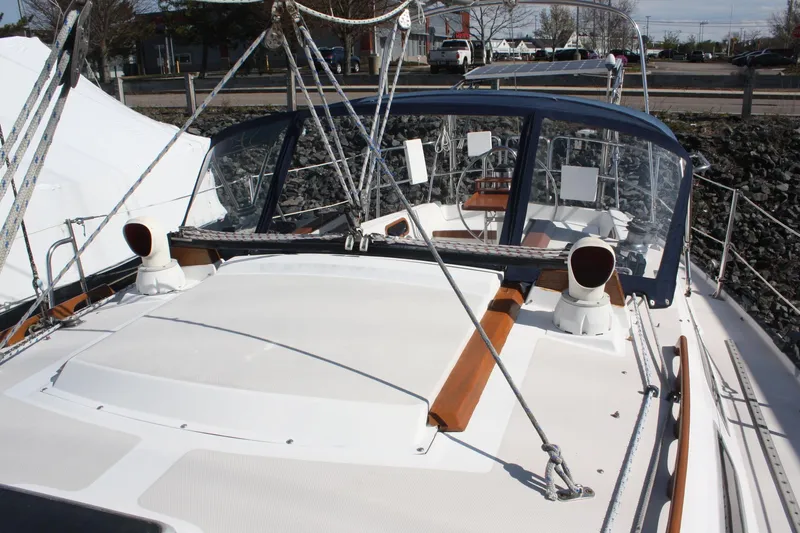 Slide: The Image of 1986 Catalina 36 sailboat deck with ropes and cockpit enclosure. - 23