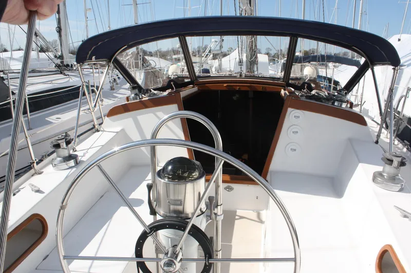 Slide: The Image of Cockpit of a 1986 Catalina 36 sailboat with steering wheel and navigation instruments. - 25