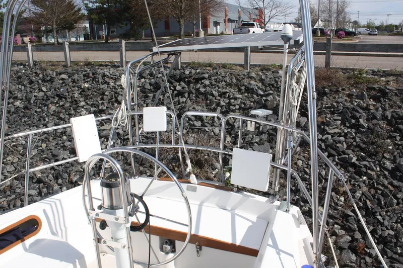 Slide: The Image of Cockpit of a 1986 Catalina 36 sailboat with steering wheel and equipment. - 28