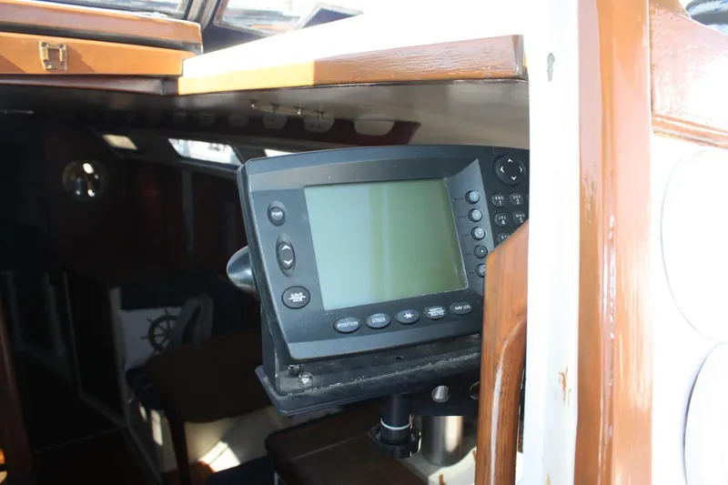 Slide: The Image of Navigation equipment inside a 1986 Catalina 36 sailboat cabin. - 34