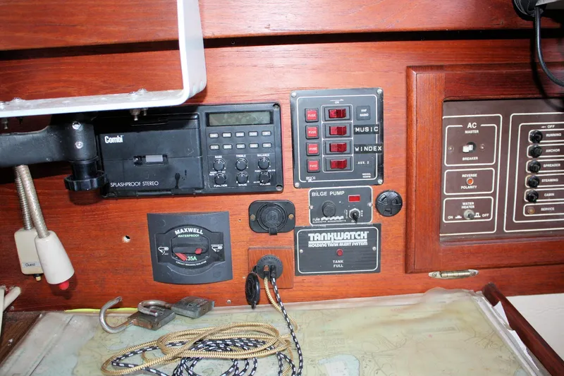 Slide: The Image of Control panel of a 1986 Catalina 36 sailboat with stereo and tank alert system. - 65