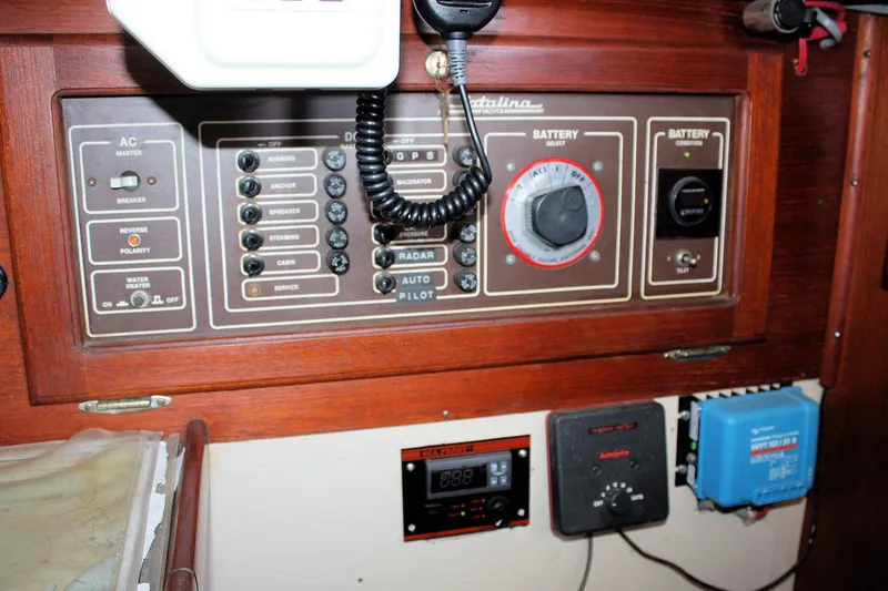 Slide: The Image of Control panel of a 1986 Catalina 36 sailboat with various switches and dials. - 66