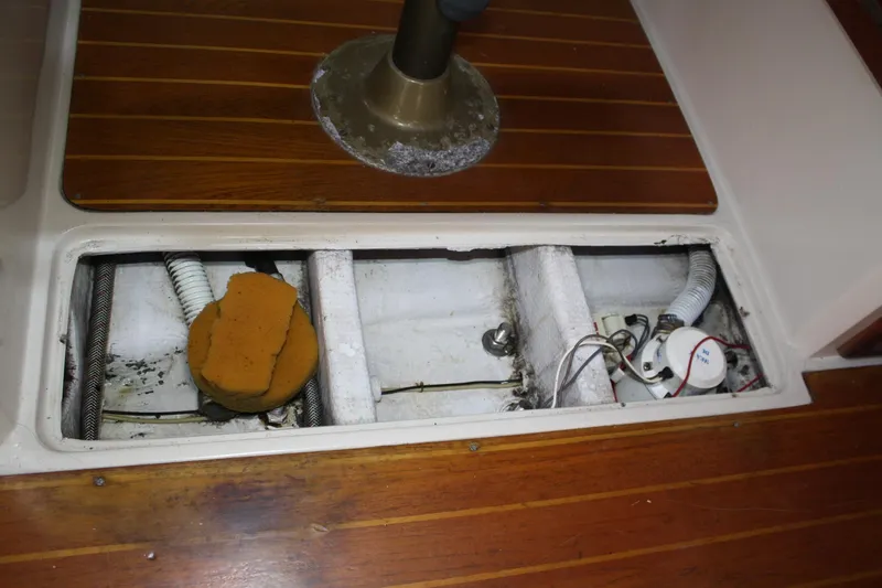 Slide: The Image of Open hatch on 1986 Catalina 36 sailboat showing interior components and wiring. - 68