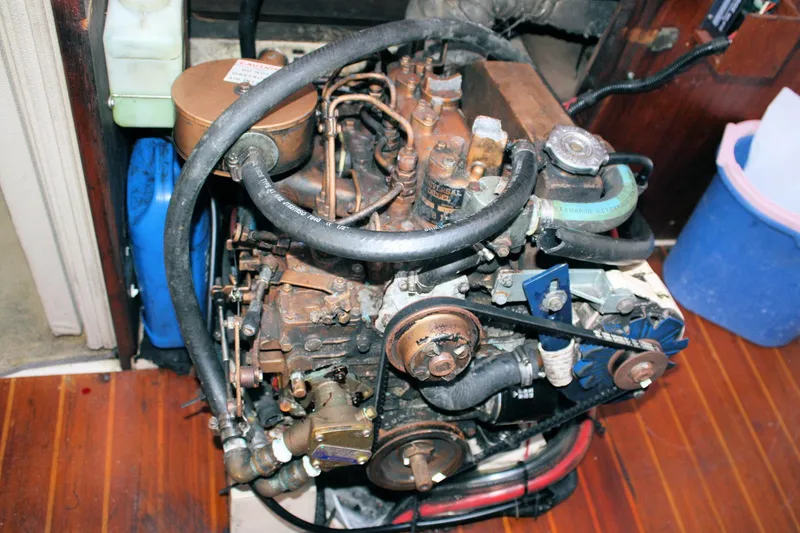 Slide: The Image of Engine of a 1986 Catalina 36 sailboat, showing hoses and components. - 71