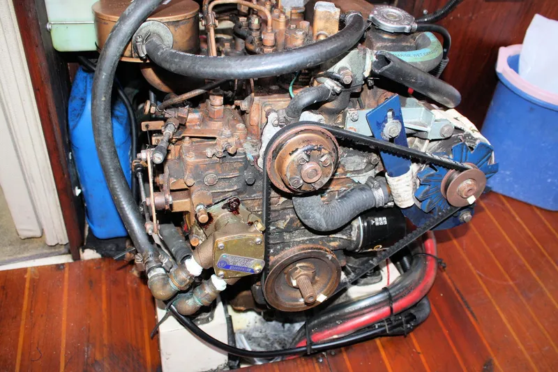 Slide: The Image of Engine of a 1986 Catalina 36 sailboat, showing belts and hoses. - 72