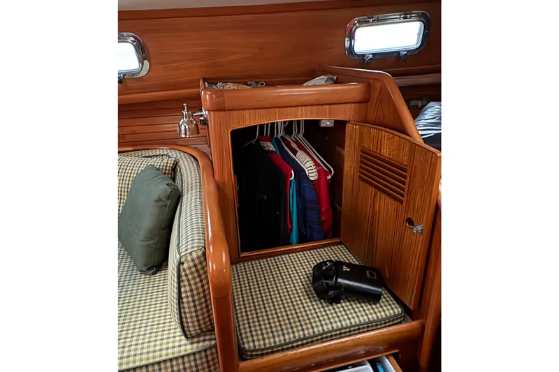 Slide: The Image of Cozy cabin interior of 1990 Little Harbor 36 yacht with wooden closet and seating. - 11