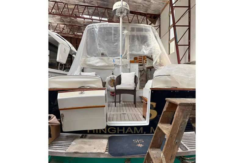 Slide: The Image of 1990 Little Harbor 36 yacht in storage, covered and equipped with Garmin radar. - 2