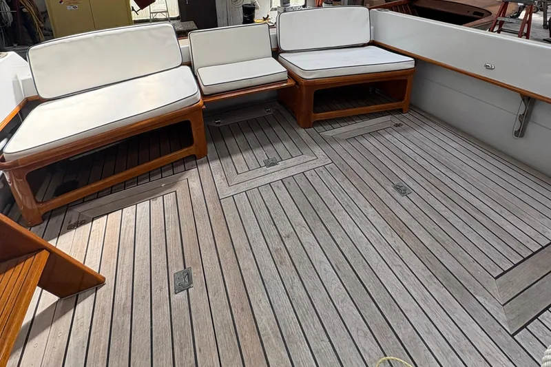 Slide: The Image of Teak deck and cushioned seating on a 1990 Little Harbor 36 yacht. - 4