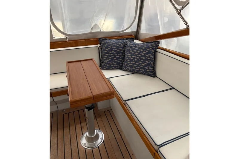 Slide: The Image of Cozy seating area on a 1990 Little Harbor 36 yacht with nautical-themed cushions. - 5