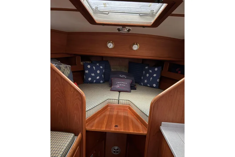 Slide: The Image of Cozy cabin interior of 1990 Little Harbor 36 sailboat with cushions and pillows. - 7