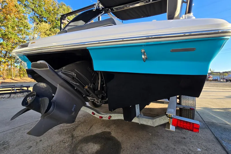 Slide: The Image of 2019 Regal 2000 ES Bowrider boat on trailer, showcasing propeller and vibrant blue hull. - 10