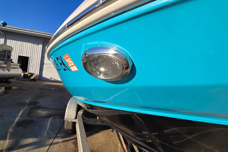 Slide: The Image of 2019 Regal 2000 ES Bowrider in vibrant blue, parked on a trailer. - 13