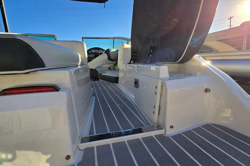 Slide: The Image of 2019 Regal 2000 ES Bowrider interior with open storage compartment and sleek seating. - 22