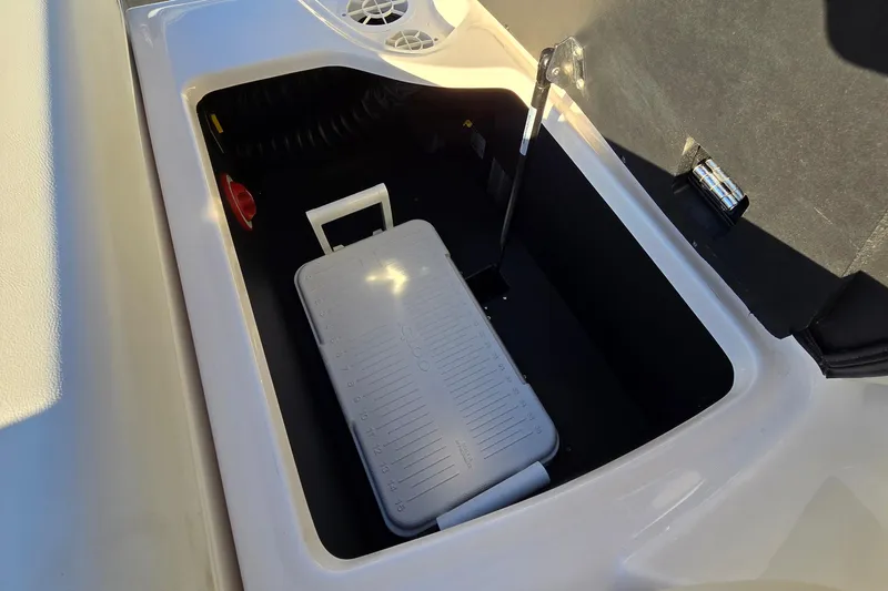 Slide: The Image of Storage compartment in 2019 Regal 2000 ES Bowrider boat with cooler inside. - 27