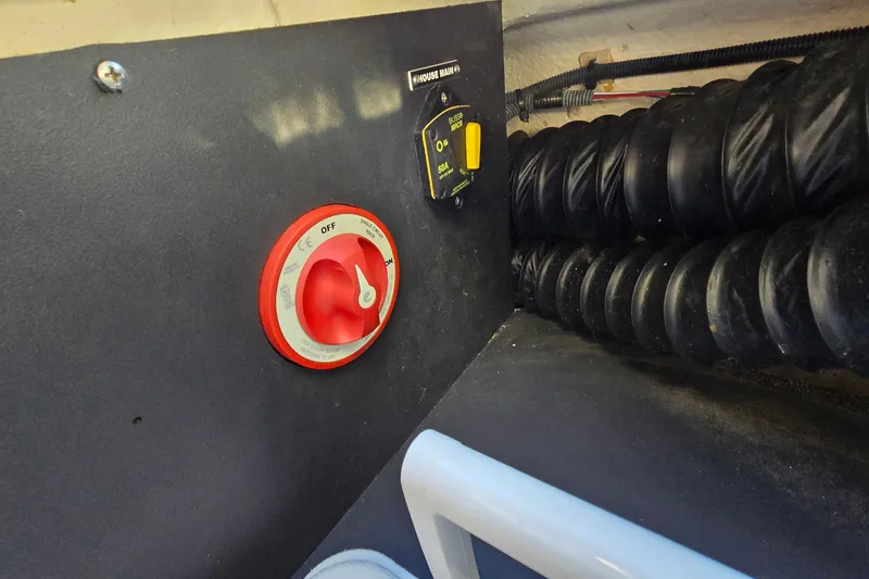 Slide: The Image of Battery switch and wiring in a 2019 Regal 2000 ES Bowrider boat. - 28