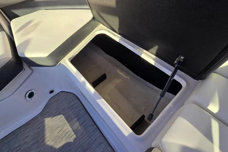 Slide: The Image of Open storage compartment in 2019 Regal 2000 ES Bowrider boat interior. - 34