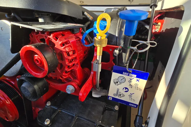 Slide: The Image of Engine compartment of a 2019 Regal 2000 ES Bowrider with easy drain instructions. - 36