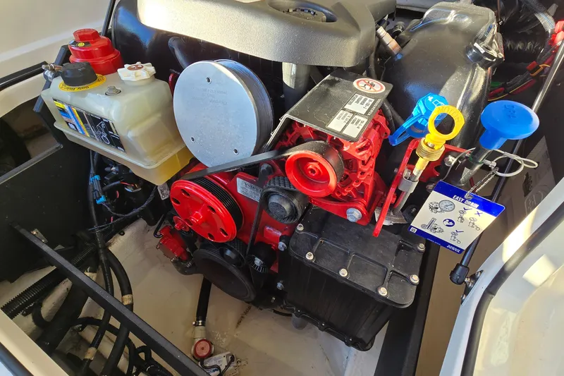 Slide: The Image of Engine compartment of a 2019 Regal 2000 ES Bowrider, showcasing detailed components and vibrant colors. - 37
