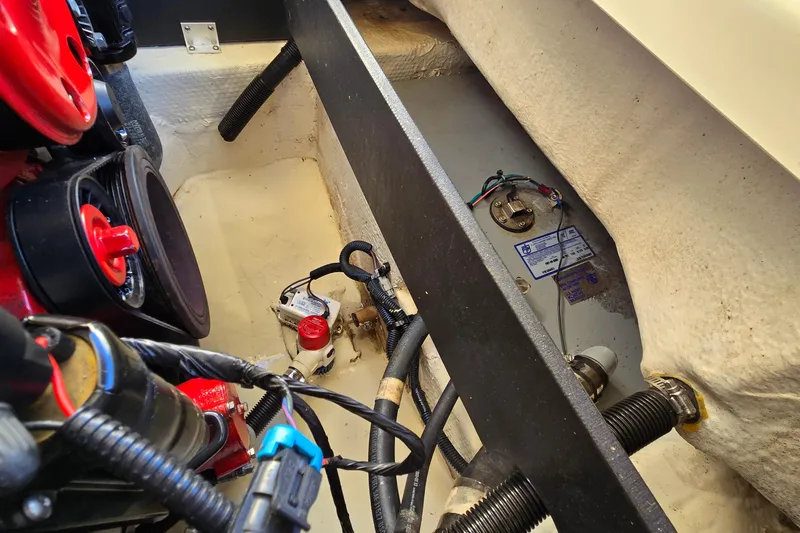 Slide: The Image of Engine compartment of a 2019 Regal 2000 ES Bowrider, showcasing wiring and components. - 39