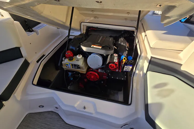 Slide: The Image of Engine compartment of a 2019 Regal 2000 ES Bowrider boat, showcasing detailed components. - 40