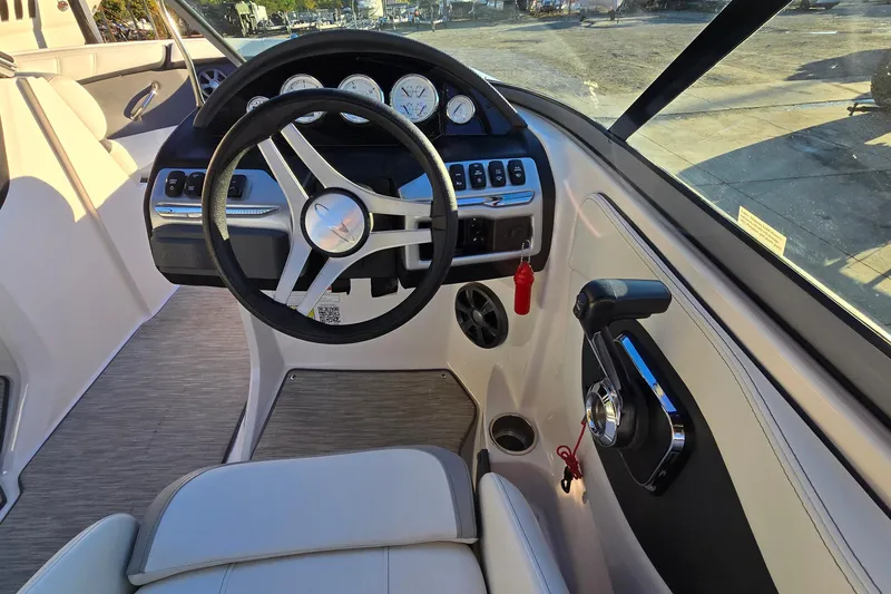 Slide: The Image of 2019 Regal 2000 ES Bowrider dashboard with steering wheel and controls. - 42