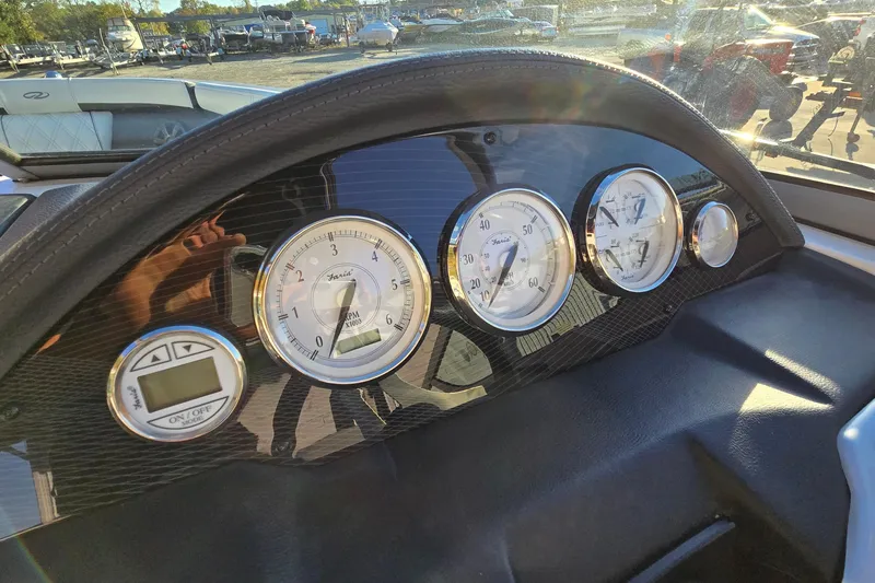 Slide: The Image of Dashboard of a 2019 Regal 2000 ES Bowrider with gauges and controls. - 43