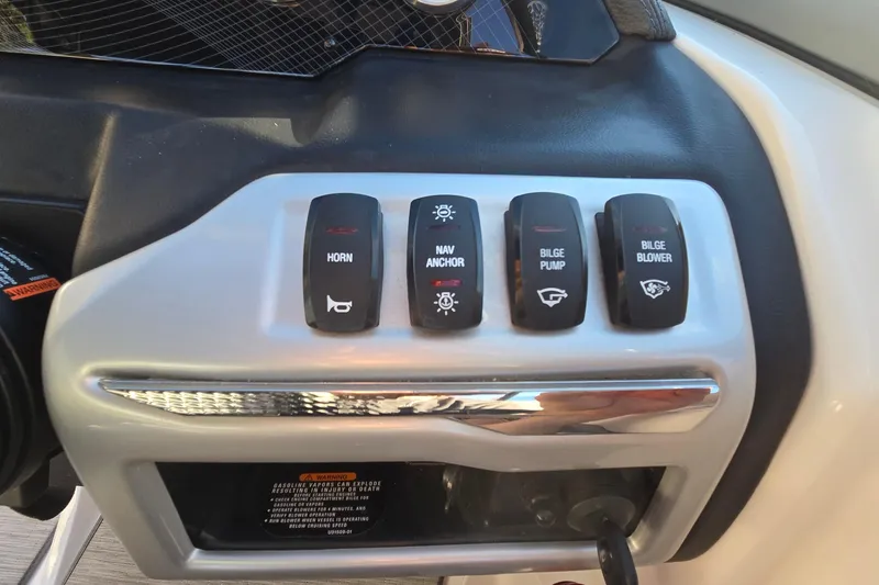 Slide: The Image of Control panel of a 2019 Regal 2000 ES Bowrider boat with labeled switches. - 46