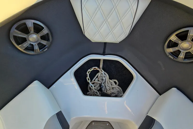 Slide: The Image of Interior of 2019 Regal 2000 ES Bowrider with speakers and rope storage. - 48