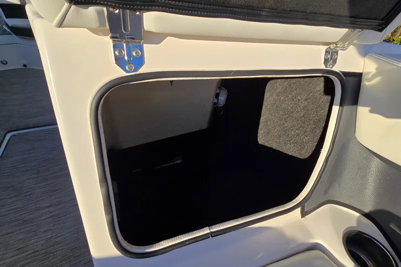 Slide: The Image of Open storage compartment in 2019 Regal 2000 ES Bowrider boat. - 51